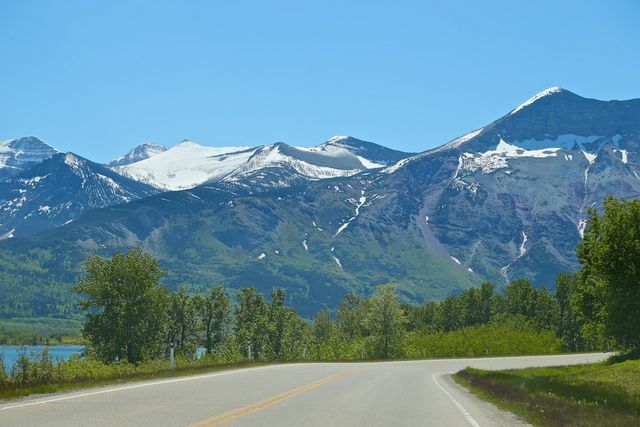 Waterton -- Snow capped mountains in July 