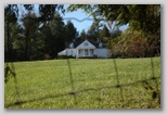 Unique view of home through a fence