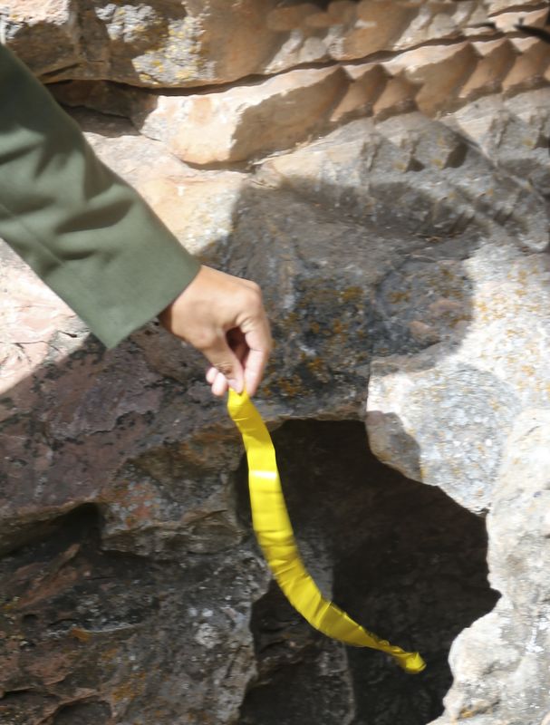 During times of changing air pressure, the cave sucks in air or expels air 